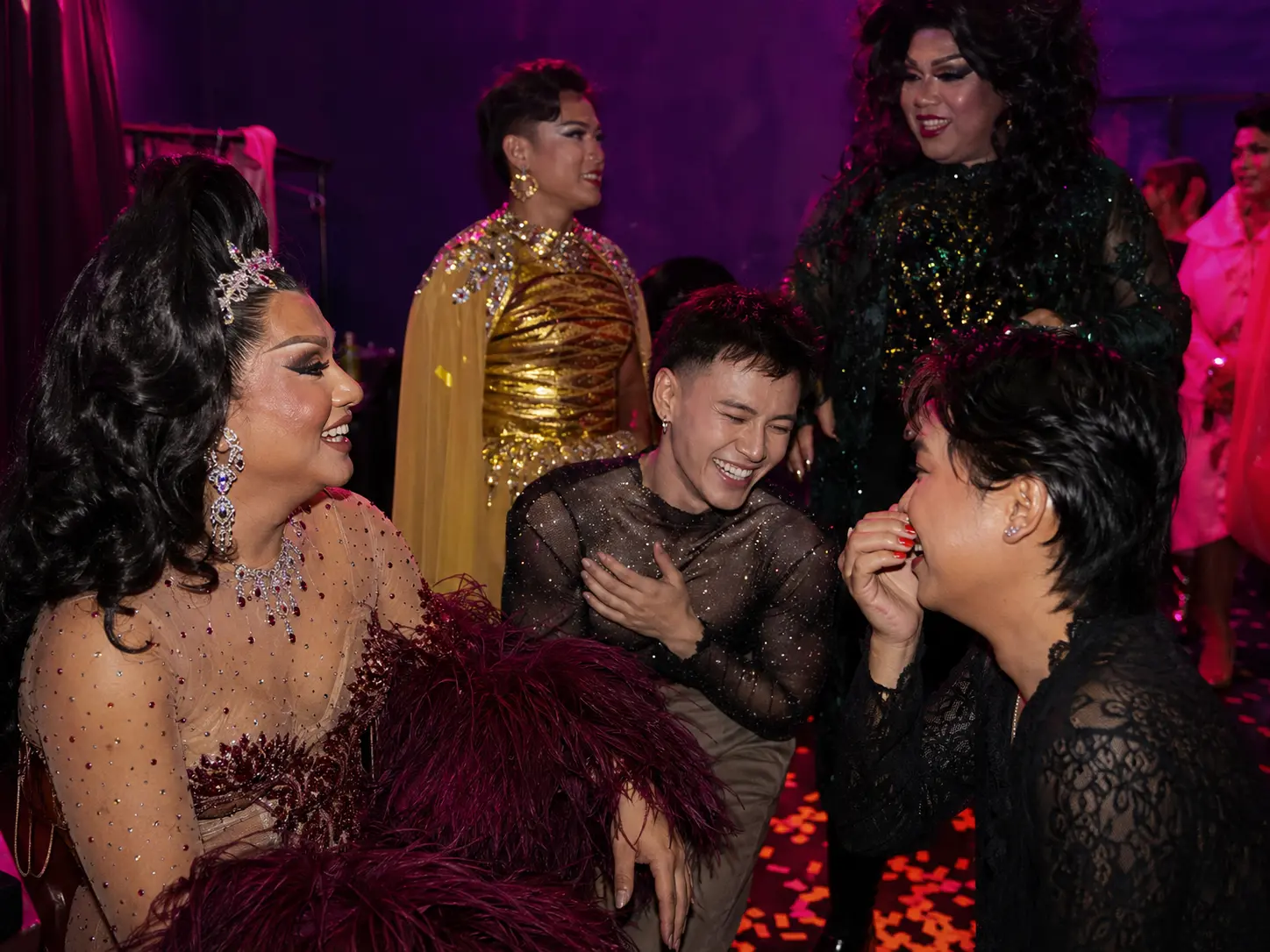 Backstage carnival community scene after a drag performance